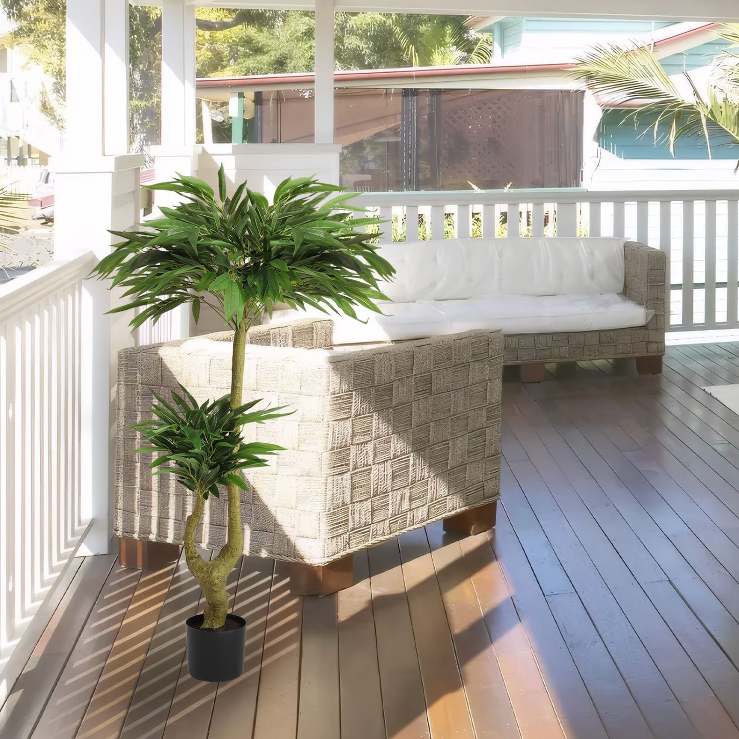Elegant long artificial plants for indoors adding greenery to a stylish living room setting