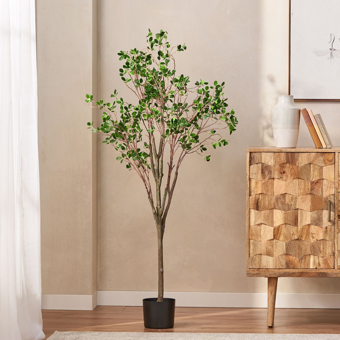 Milan leaf artificial plant in a black pot, enhancing home decor with a natural touch