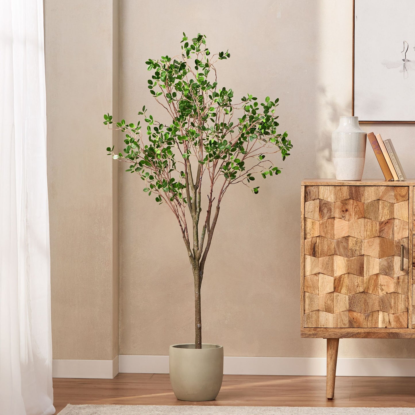 Milan leaf artificial plant in a modern pot, bringing a fresh look to home decor