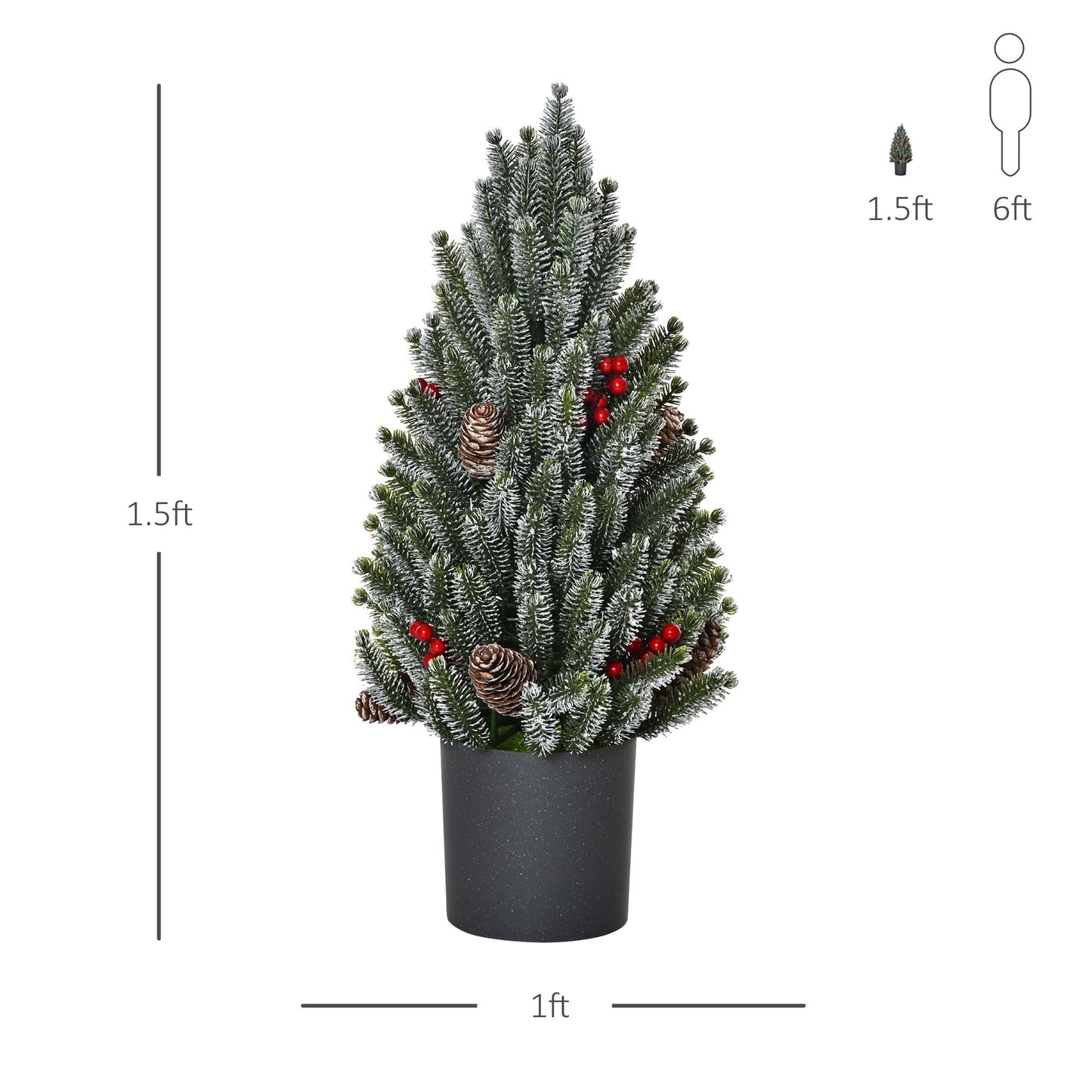 Miniature snow flocked Christmas tree decorated with pinecones and red berries in a black pot