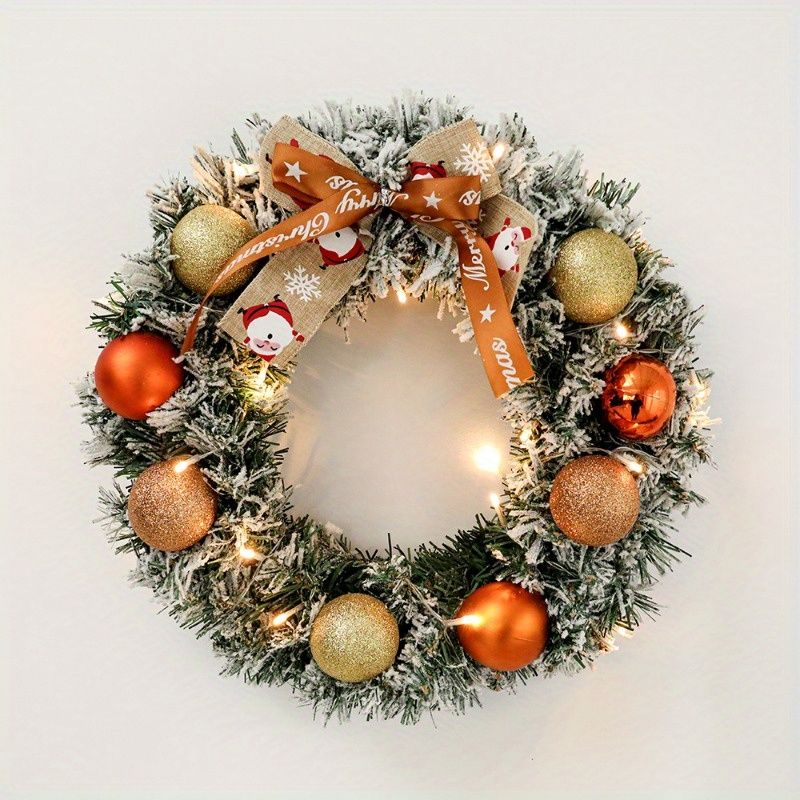 Festive 24-inch pine Christmas wreath adorned with ornaments and a decorative bow