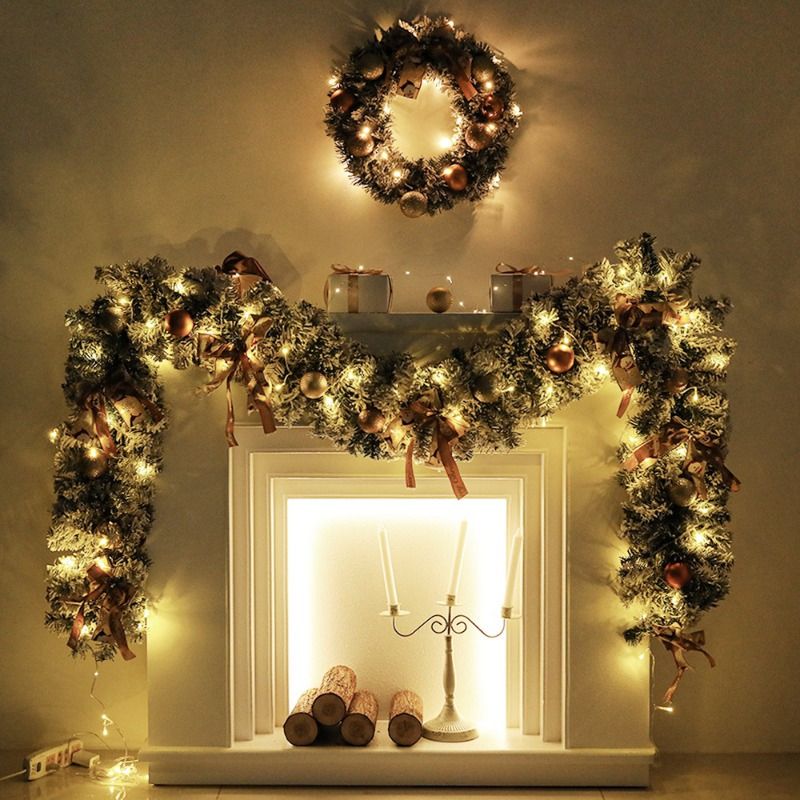 24-inch pine Christmas wreath adorned with lights and ornaments above a festive mantel display