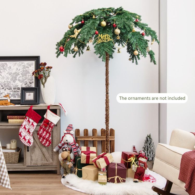 FauxMart.com pre-lit Christmas palm tree decorated with ornaments and surrounded by holiday gifts in living room