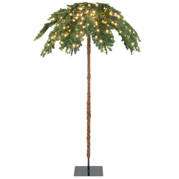 FauxMart.com pre-lit Christmas palm tree with glowing white lights and realistic green fronds on a sturdy base