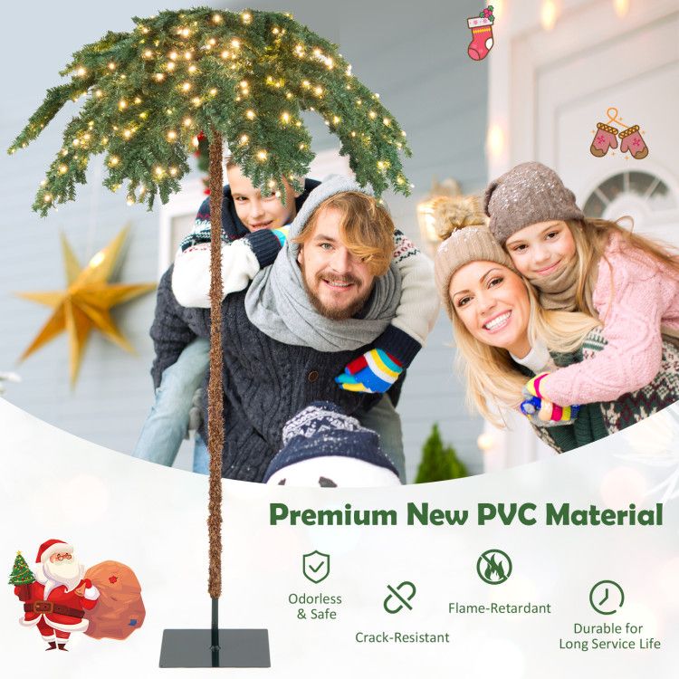 Pre-lit Christmas palm tree with warm white lights on a black stand for festive holiday decor
