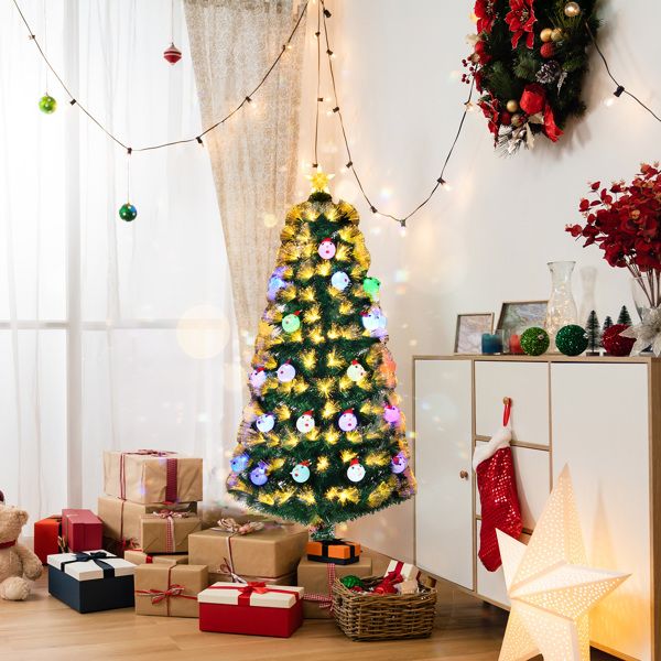 Pre-lit fiber optic Christmas tree with colorful lights in a cozy holiday living room setting