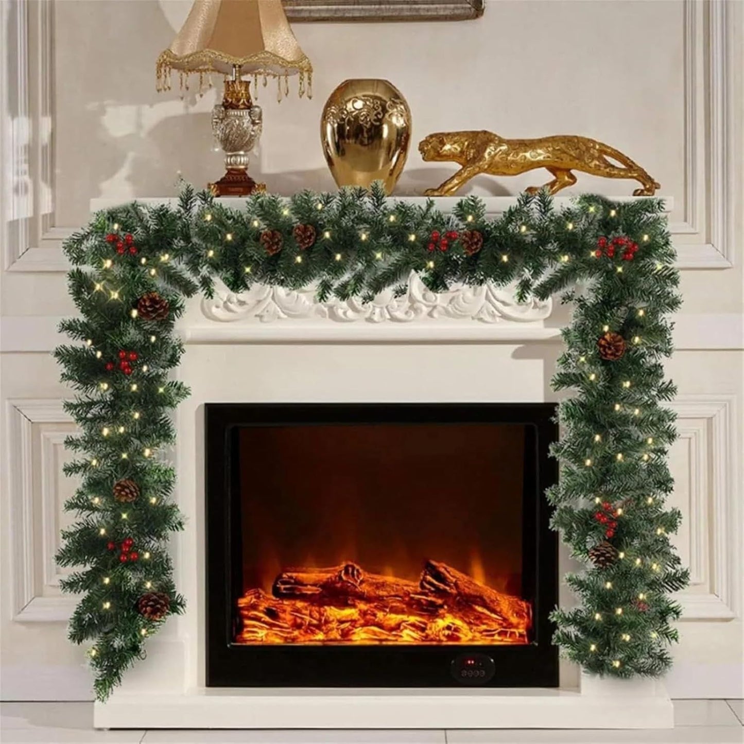 Prelit artificial Christmas garland with pine cones and berries draped over a fireplace mantel