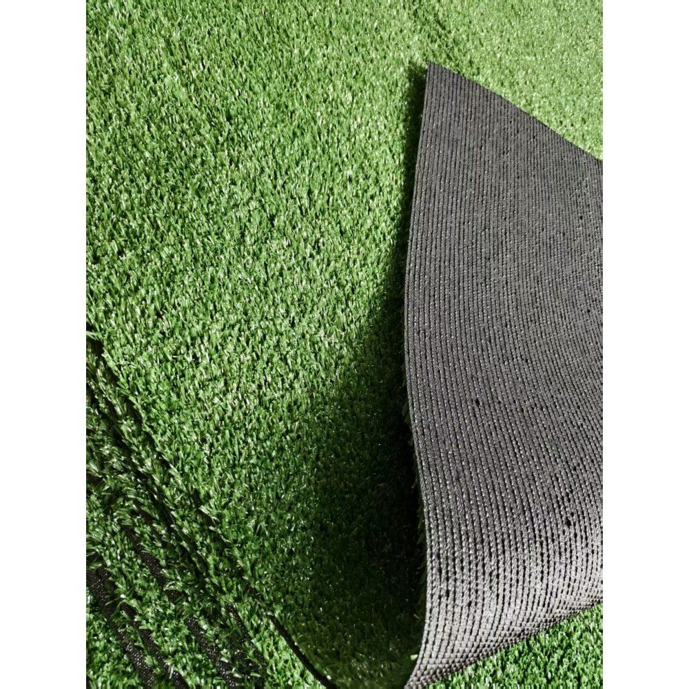 Close-up of premium artificial turf mat showing realistic green fibers for grass-like appearance.