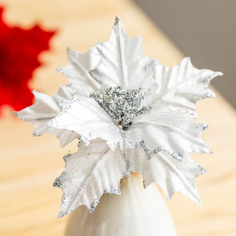 Silver glittered rattan horn Christmas tree ornament shaped like a holly leaf decoration
