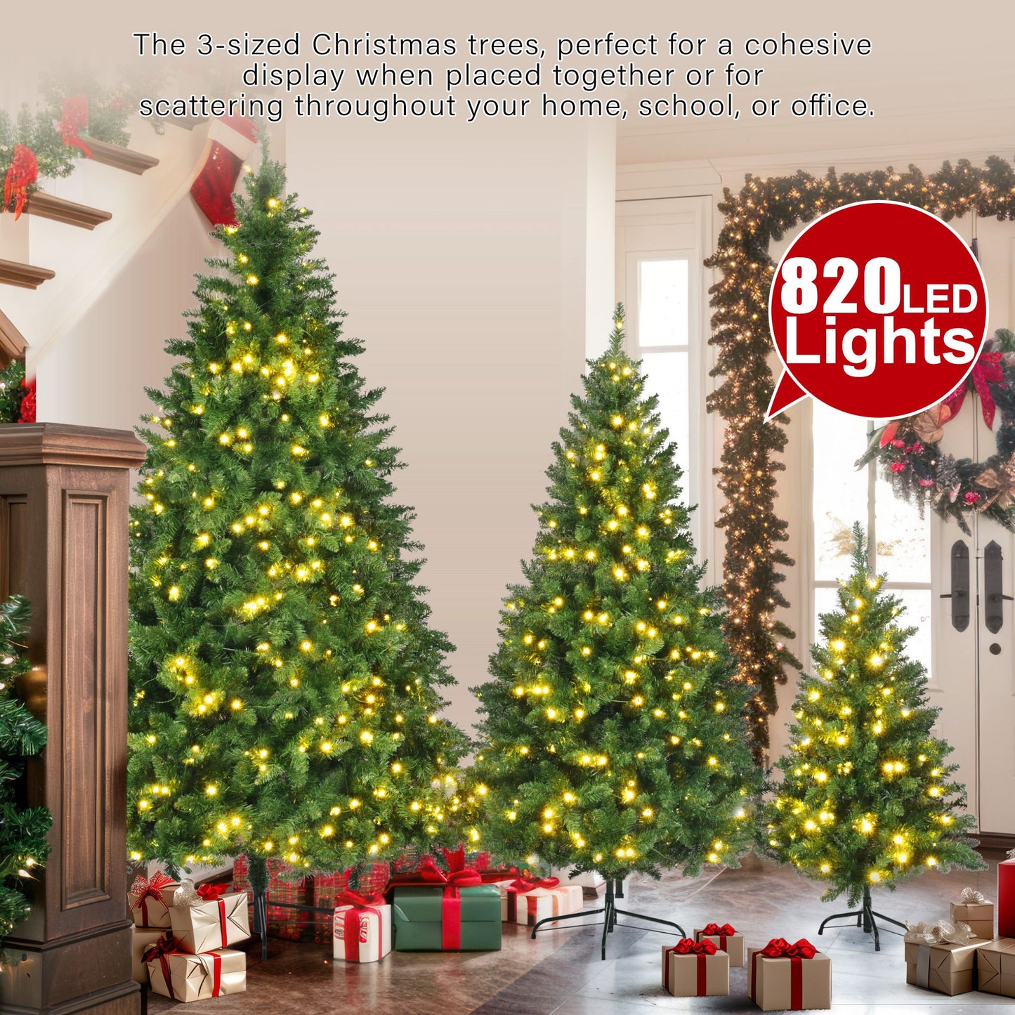 Three slim artificial Christmas trees with lights in different sizes decorated with warm white LED lights in a cozy living room