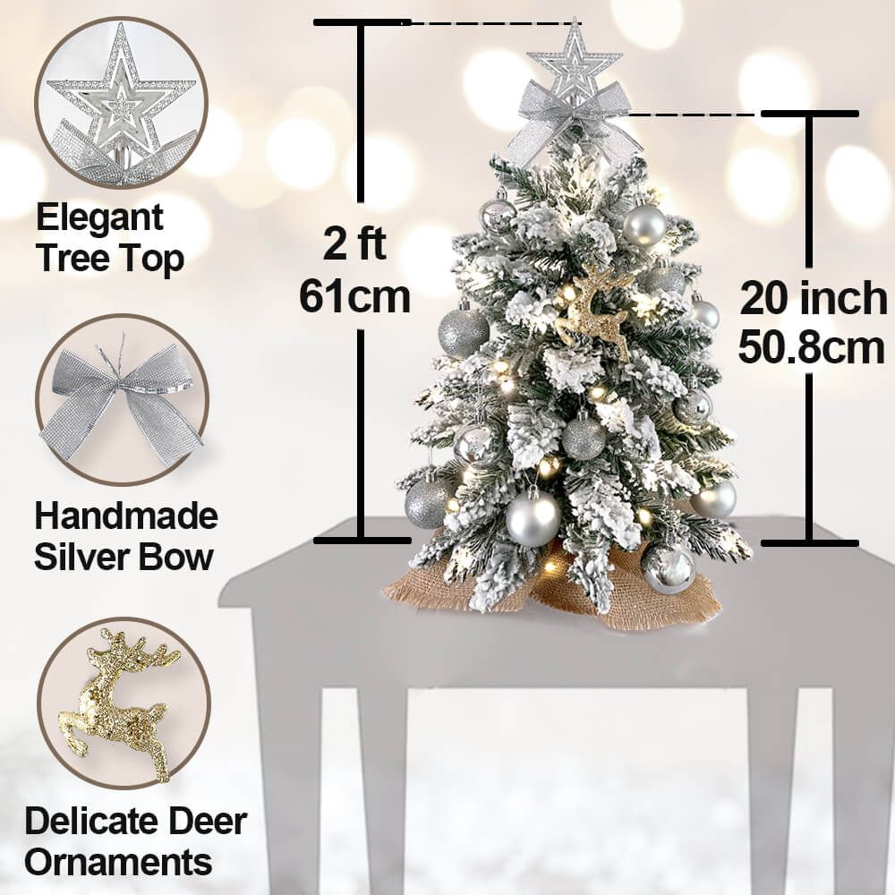 Small Xmas tree for office desk with elegant star top, handmade silver bow, delicate deer ornaments, and LED lights
