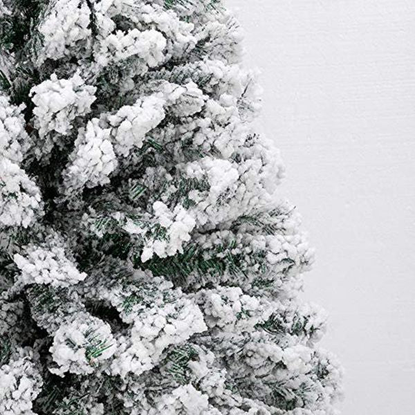 Snow flocked artificial Christmas tree with realistic snow-dusted branches for festive decoration