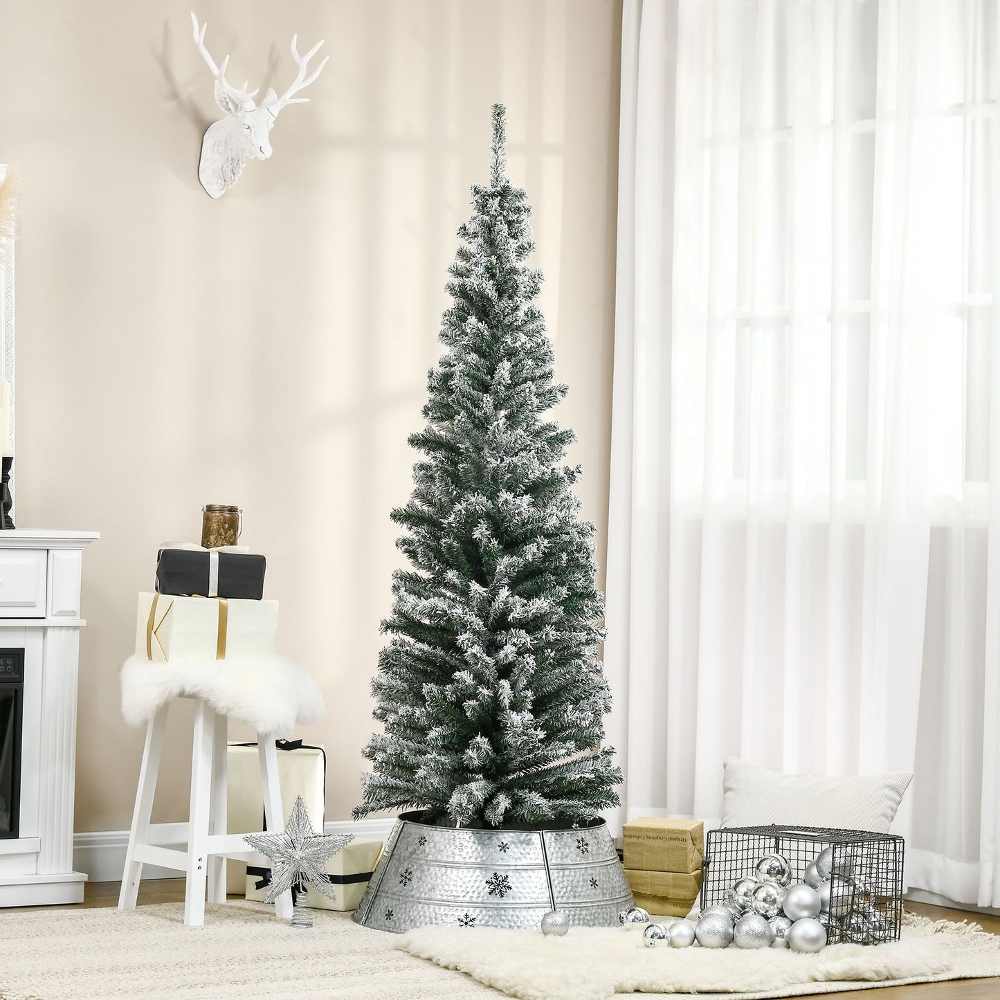 6 foot snow flocked Christmas tree with metal stand in a cozy living room decor setup