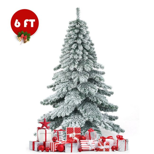 6 foot snow flocked Christmas tree with red and white wrapped presents at the base