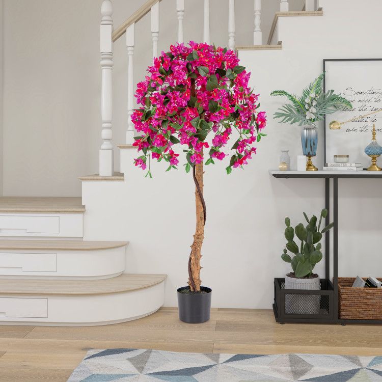 Artificial azalea tree set with vibrant pink flowers in black pot displayed in modern living room