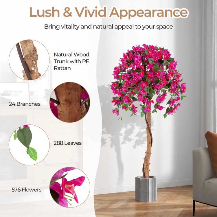 Artificial azalea tree set with vibrant pink flowers, natural wood trunk, 24 branches, and 288 leaves in a modern living room