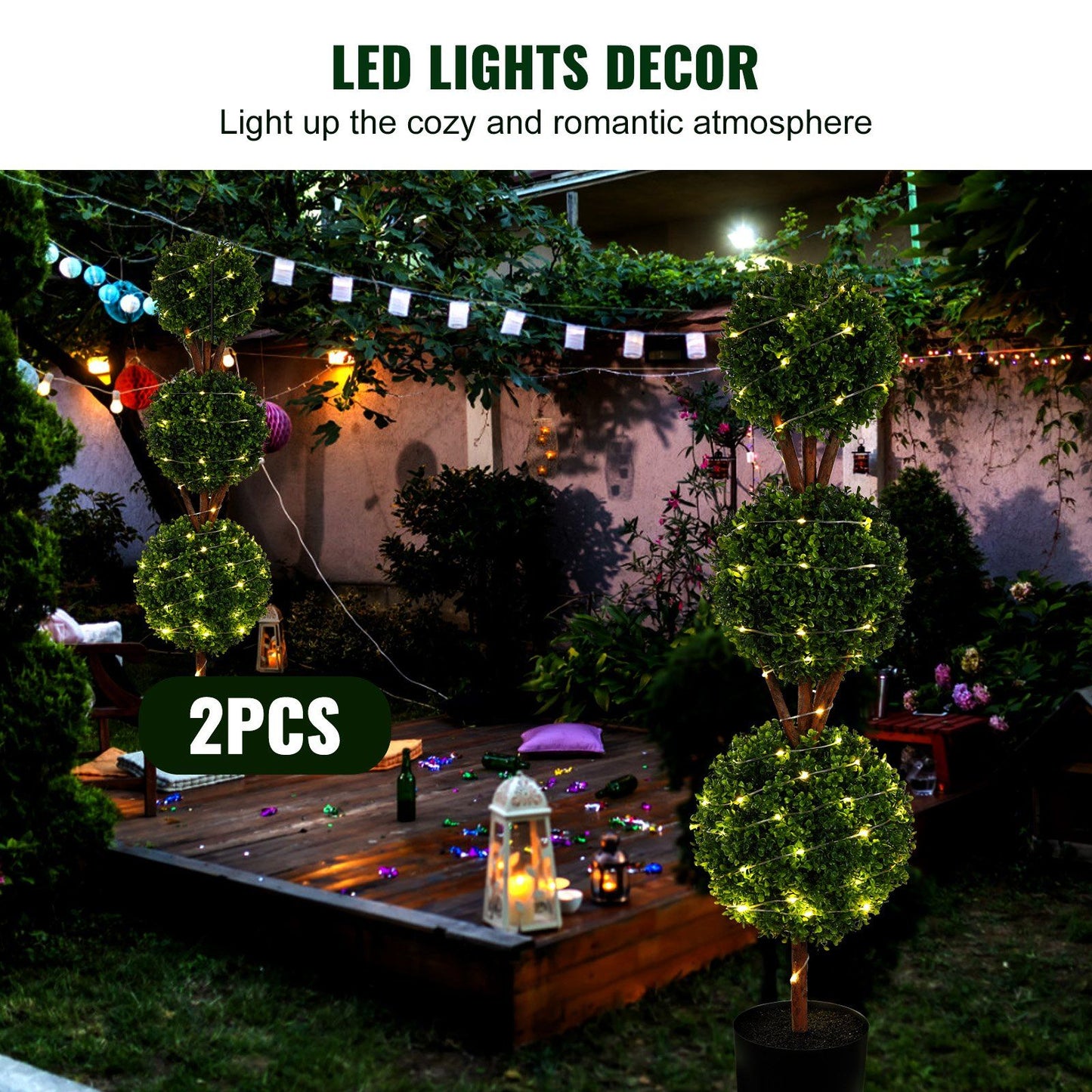 Two faux boxwood trees set with LED lights creating a cozy romantic outdoor atmosphere by FauxMart.com