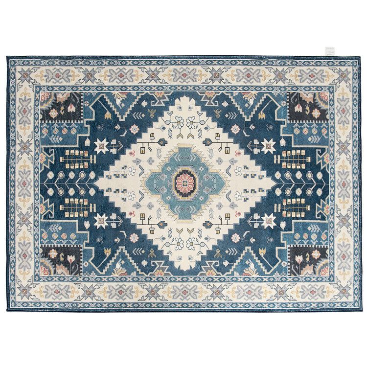 Blue and cream patterned faux wool area rugs with intricate geometric and floral designs