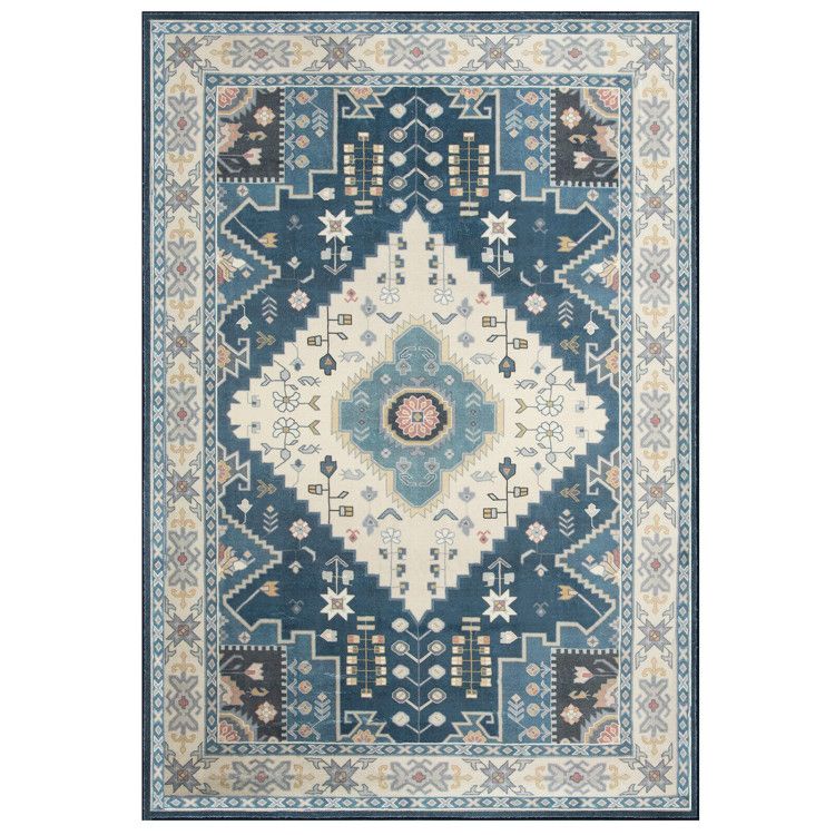Blue and cream traditional patterned faux wool area rugs with floral and geometric designs