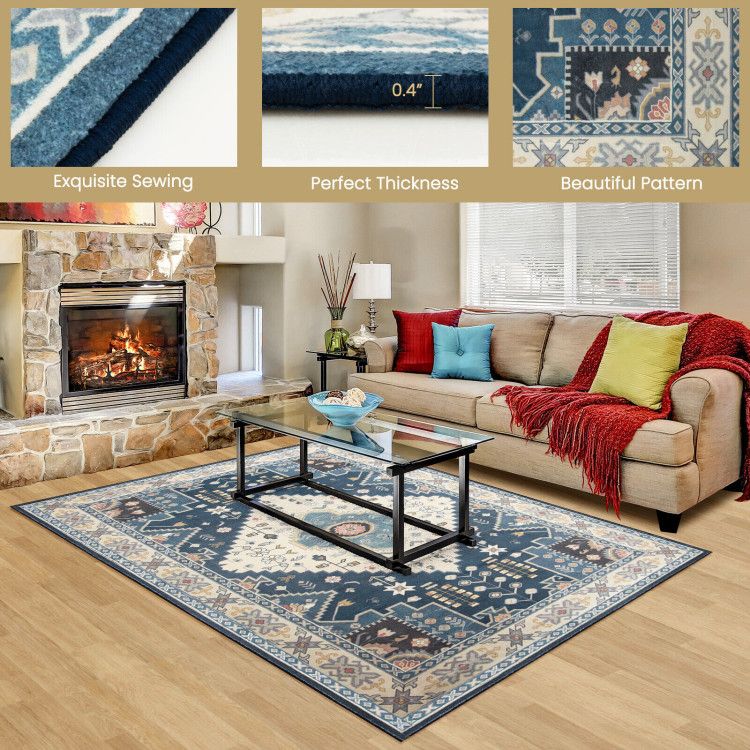 Blue and beige faux wool area rugs with intricate pattern in living room by fireplace