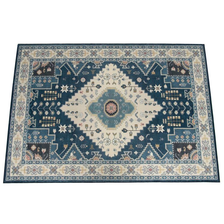 Blue and cream faux wool area rugs with intricate geometric and floral patterns