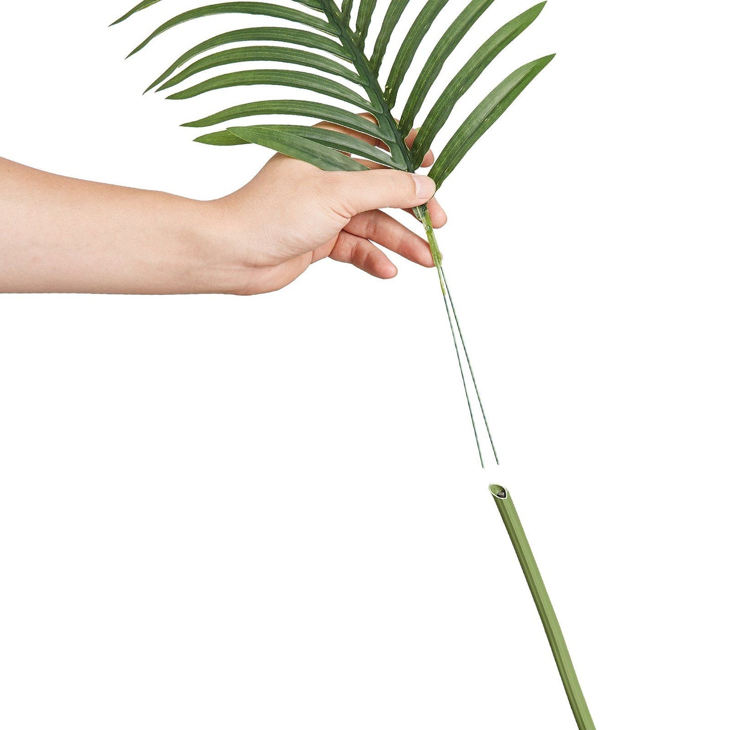 Hand assembling a 6ft artificial palm tree branch with green leaves and detachable stem piece