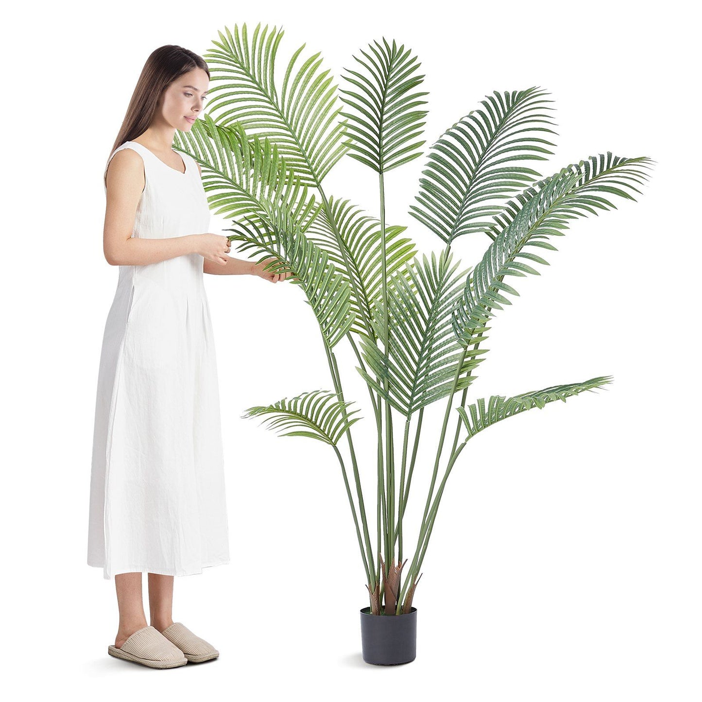 6ft artificial palm tree in black pot next to woman in white dress for home decor