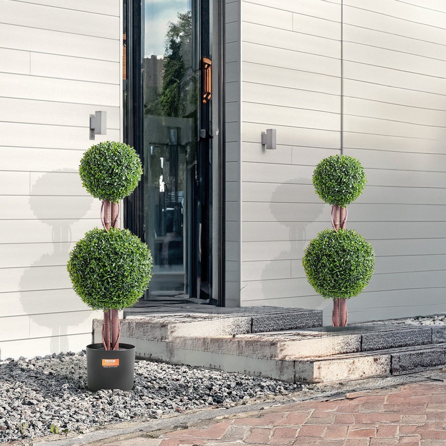 FauxMart.com artificial boxwood topiary tree with double green ball design in black planter outdoors