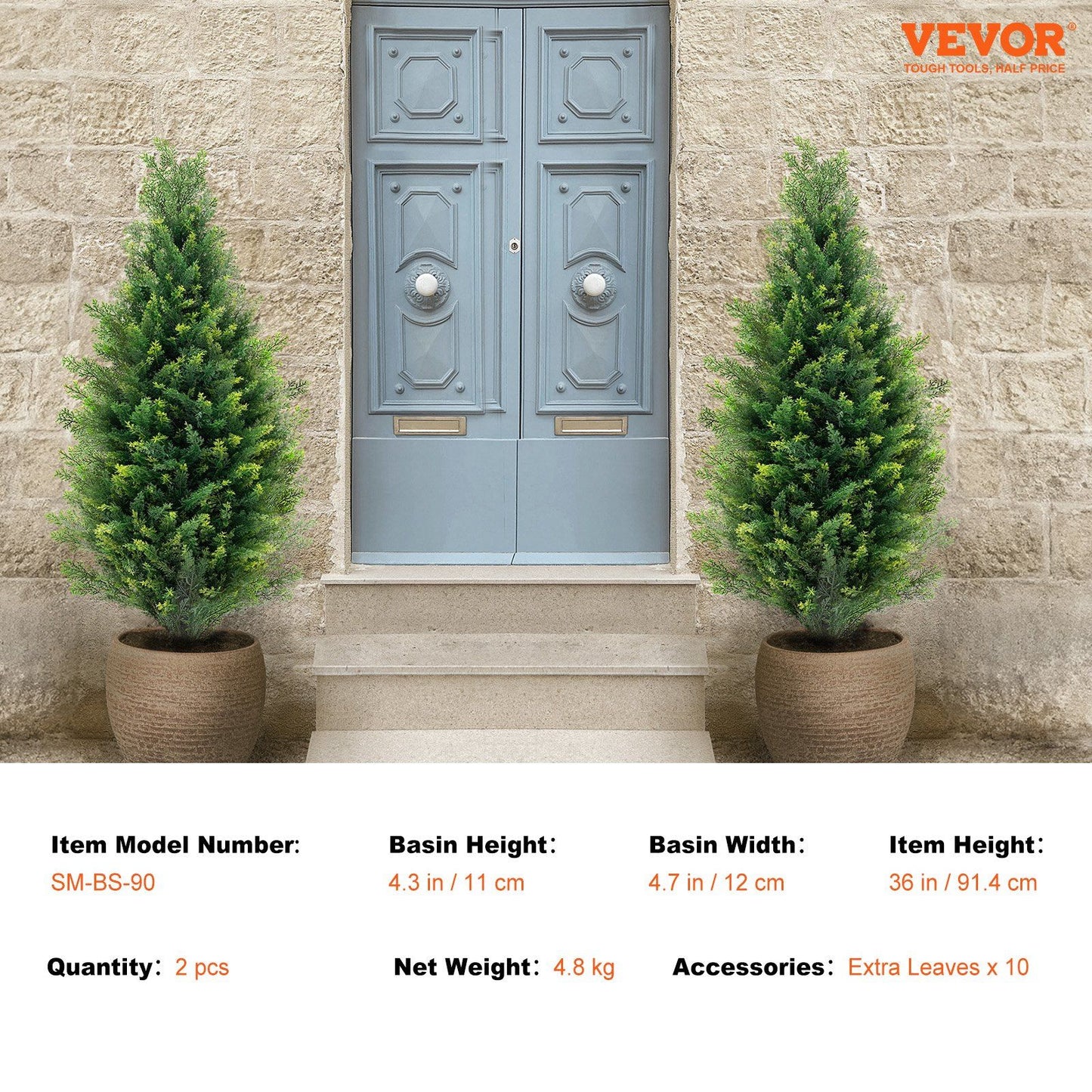 Pair of artificial cedar topiary trees in pots placed on either side of a gray front door