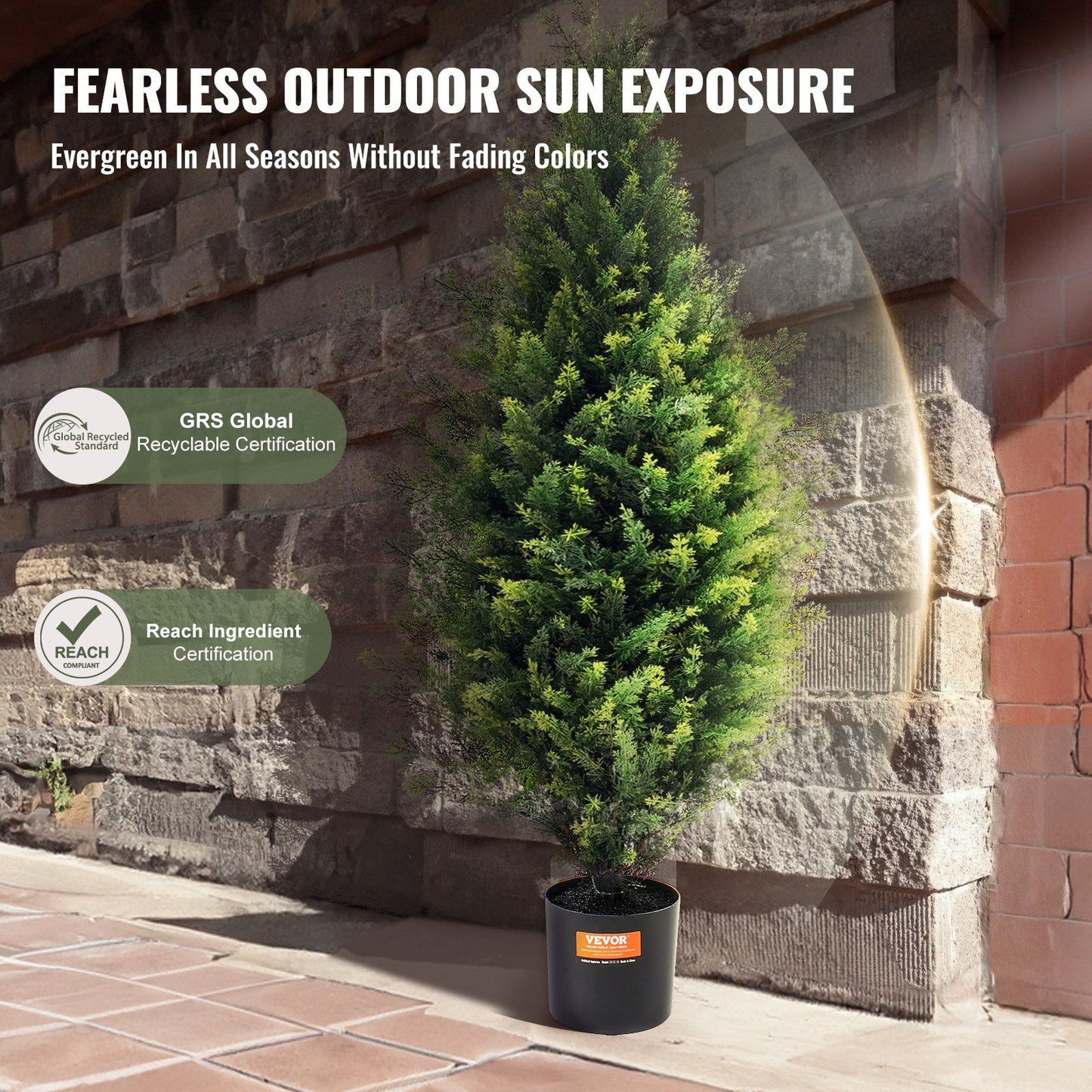 Artificial cedar topiary trees in black pot showing evergreen color without fading outdoors