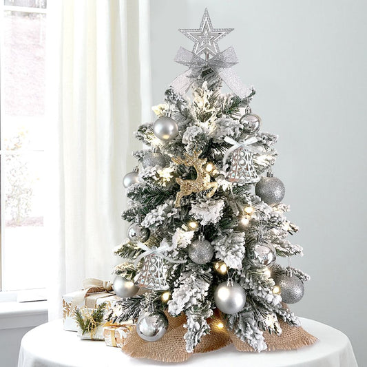 22 inch artificial Christmas tree silver decorated with silver ornaments and warm white lights on table