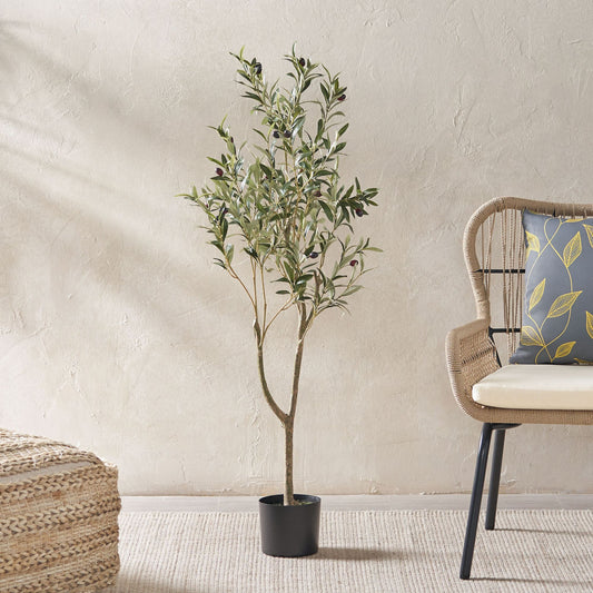 47 inch artificial olive tree in a black pot beside a chair, adding a touch of greenery to the room
