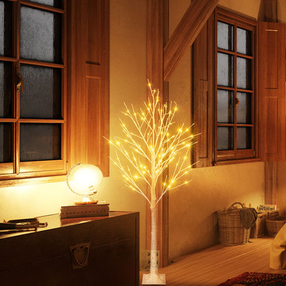 4ft snowflake Christmas tree with lights glowing warmly in cozy wooden interior