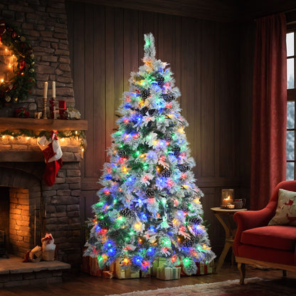 6ft pre-lit Christmas tree with snow flocking and multicolor lights in cozy living room