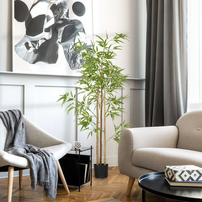 Artificial bamboo tree 6ft in a black pot placed in a modern living room with gray furniture and abstract wall art