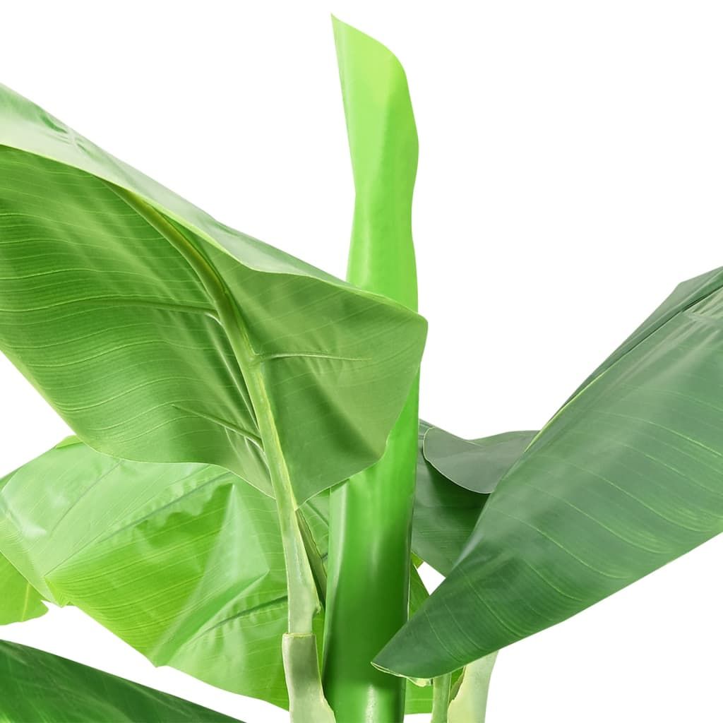 Close-up of vibrant green artificial banana tree decor leaves with realistic texture and detail