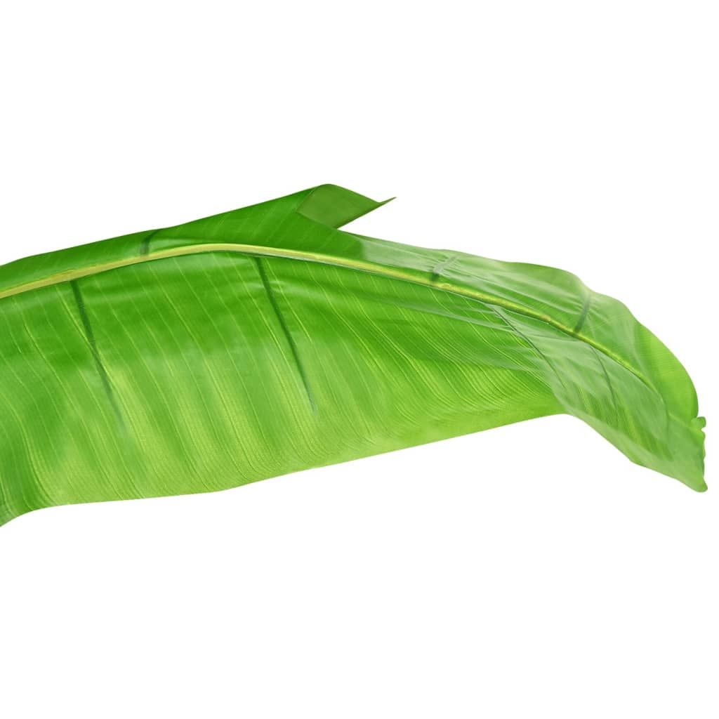 Close-up of vibrant green artificial banana tree decor leaf with realistic texture