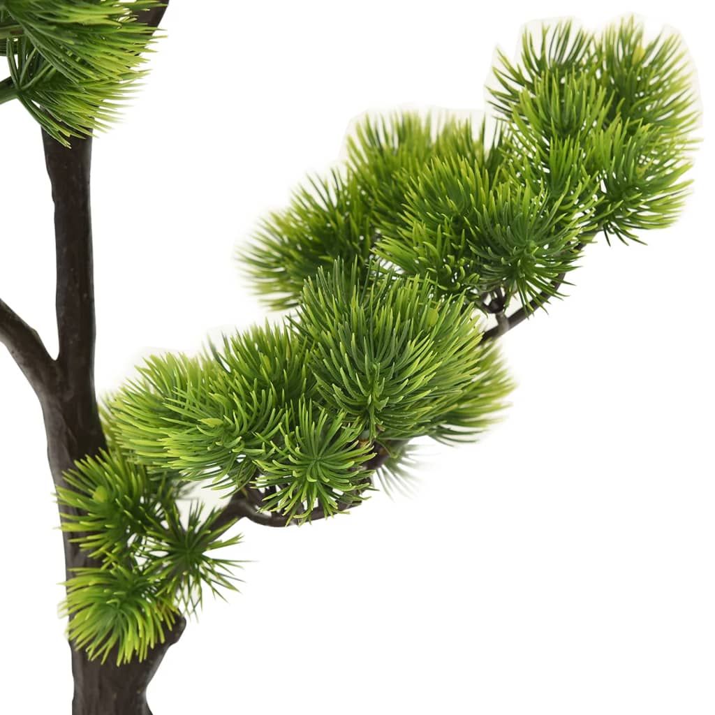 Close-up of green artificial bonsai tree with pot showing detailed pine-like leaves on branch