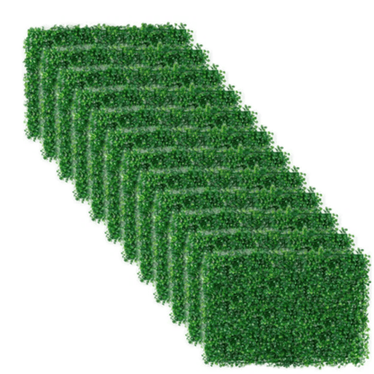 Stack of green artificial boxwood hedge panels for outdoor and indoor decorative privacy walls