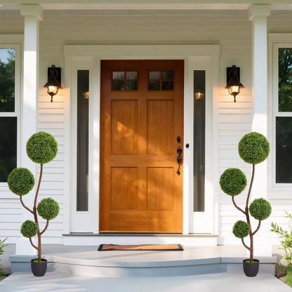 Elegant artificial boxwood topiary plants in decorative pots for outdoor entryways