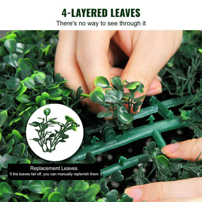 Close-up of hands attaching replacement leaves to artificial boxwood topiary balls with dense 4-layered leaves