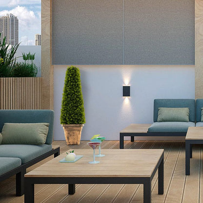Artificial boxwood topiary tree in a modern indoor setting with stylish furniture and decor