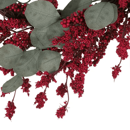 Close-up of artificial Christmas wreath with eucalyptus leaves and red berry clusters from FauxMart.com
