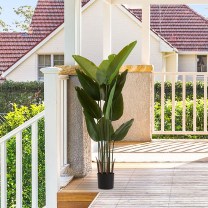 Artificial green plant set in a stylish pot, perfect for enhancing home decor with a touch of nature