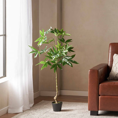 Artificial money tree 47 inch in a modern living room next to a cozy brown couch