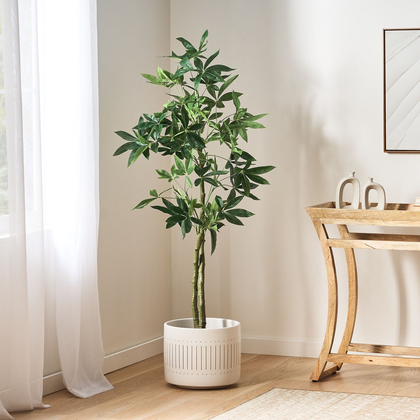 Elegant artificial money tree decor in a white pot, perfect for enhancing home aesthetics