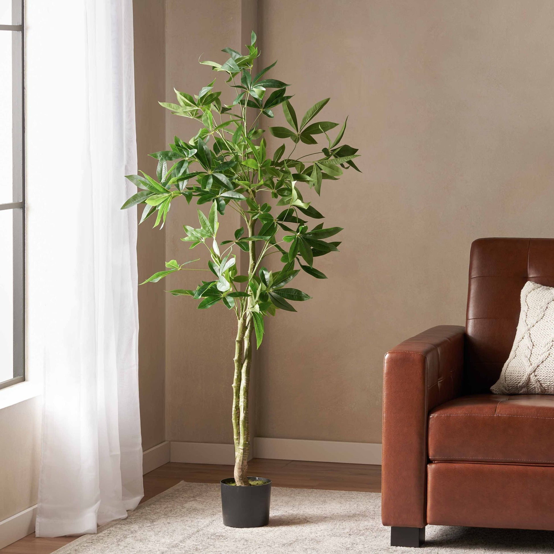 Lifelike artificial money tree decor in a black pot for stylish home decoration