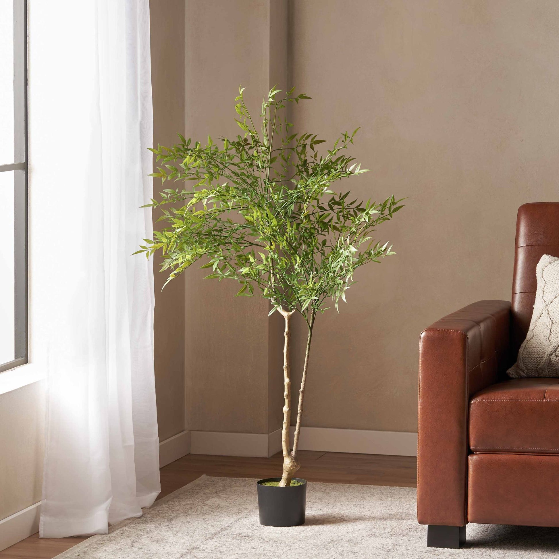 Lifelike artificial nandina plant decor in a black pot, suitable for home or office styling