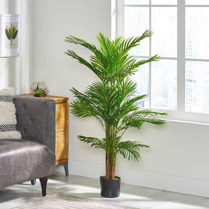 51 inch artificial palm tree in a stylish living room setting next to a gray sofa