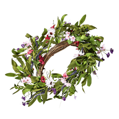 Artificial pink daisy wreath with green leaves and purple accents on a brown vine base